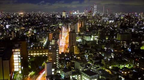 Traffic in Downtown Tokyo, Japan at Night - Skyline Time Lapse Stock Footage