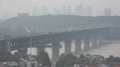 Traffic drives across the impressive 'First Yangtze River Bridge' Wuhan, China Stock Footage 60388864