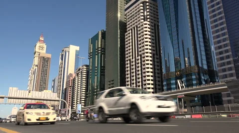 Traffic drives over the main highway crossing Dubai's financial district Video stock 50358345