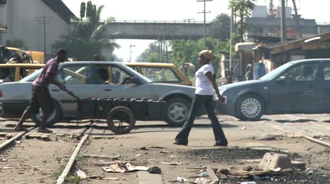 Traffic drives over suburban rail line, Lagos Stock Footage