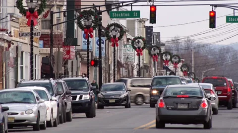 Traffic Drives through small town village during the holidays Stock Footage 35517248