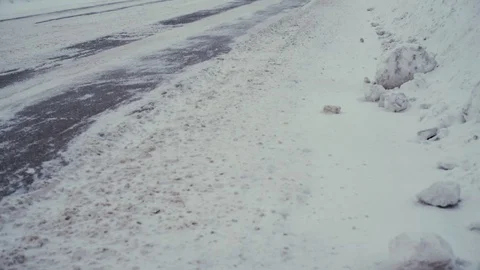 Traffic driving along freeway during intense snow storm Stock Footage 70723054