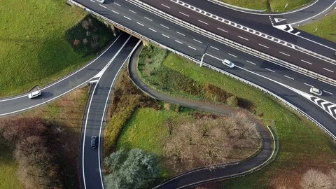 Traffic driving along a looping interchange Stock Footage 122415418
