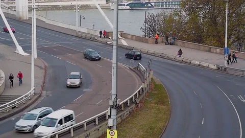 Traffic driving to the bridge over the danube river Stock Footage 70707695