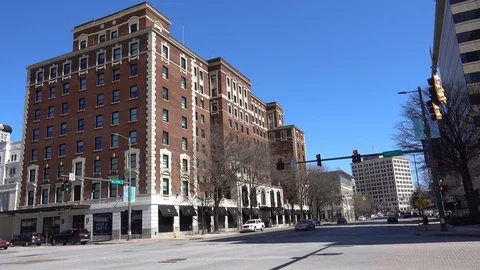 Traffic Driving By Downtown Core Intersection American City Town During Day Stock Footage 129687217