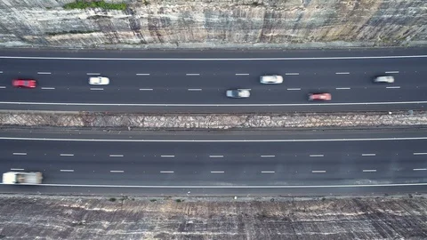 Traffic driving on a highway between two cliffs, Sydney, Australia Stock Footage 122291865