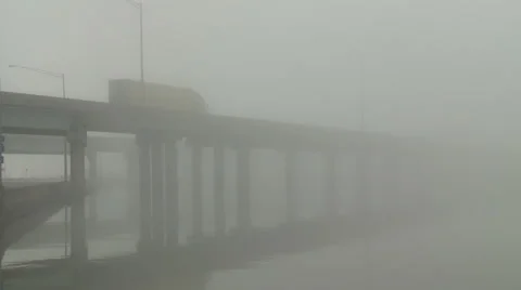 Traffic Driving on Interstate Bridge into Dense Fog Stock Footage 54714092
