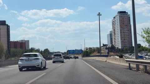 Traffic driving on Madrid M-11 toward Castellana and Chamartin Stockbeeldmateriaal 339026450