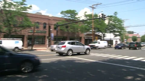 Traffic driving through downtown. (2 of 4) Stock Footage 8693917