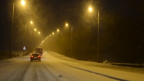 Traffic driving through winter blizzard conditions leeds uk Stock Footage 87829488