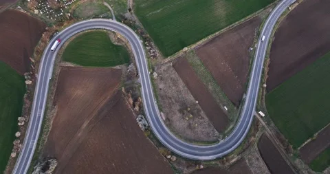 Traffic at a duble bending road in the summer autumn season. Steady footage Stock Footage 201490830