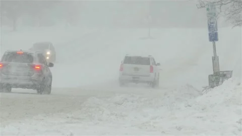 Traffic during snow storm  day on Connecticut Ave. Stock Footage 147695582