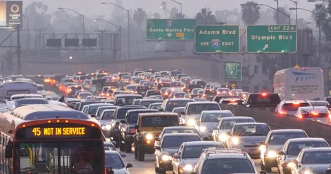 Traffic at dusk on the 110 freeway, downtown LA Stock Footage 87365015