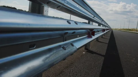 Traffic fence with light reflecting elements on freeway Stock Footage 252918285