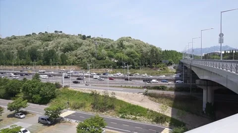 Traffic Flow on Divided Highway, Clear Sky, Green Environs, HD Stock Footage 195923770
