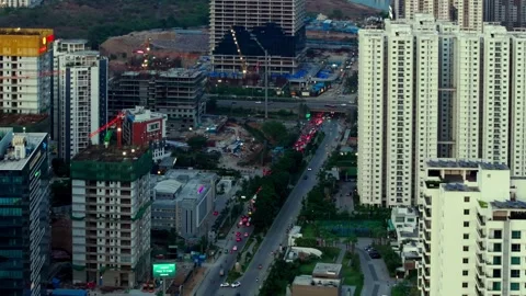 Traffic flow in financial district with surrounding high-rise buildings and Stock Footage 340557787