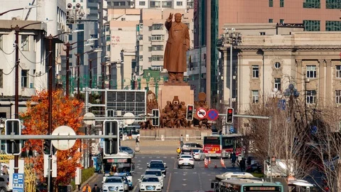 Traffic Flow in Front of Mao Zedong's Sculpture 1080P Stock Footage 115125705