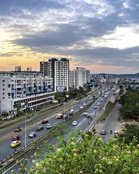 Traffic flow on a highway with nice evening sky in the background. Stock Photos