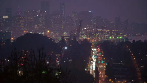 Traffic flowing below city skyline Stock Footage 149703248