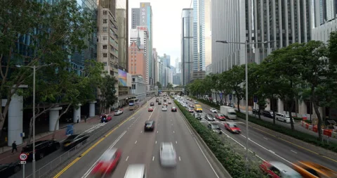 Traffic flowing on Gloucester Road in Wan Chai, Hong Kong Stock Footage 309402207