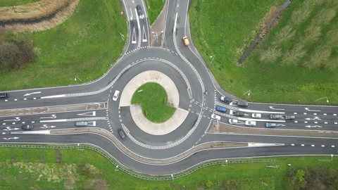 Traffic flows efficiently through roundabout system on Dutch motorway Stock Footage 271087681