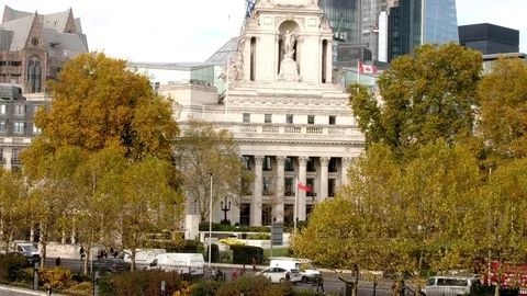 Traffic flows in front of Liberty House London Stock Footage 82803127
