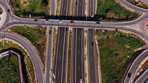 Traffic flows on a highway in Spain during a sunny day Stock Footage 327647609