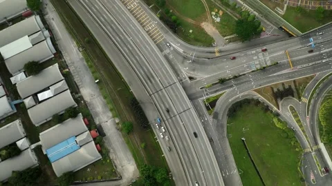 Traffic flows over complex interchange in urban area during daylight hours Stock Footage 311987435