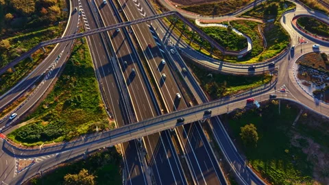 Traffic flows on the roads as vehicles navigate through an intersection in a Stock Footage 331930360