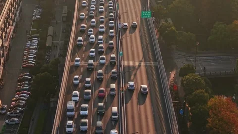 Traffic flows smoothly on a busy highway in Hangzhou, China during the late Stock Footage 324699888