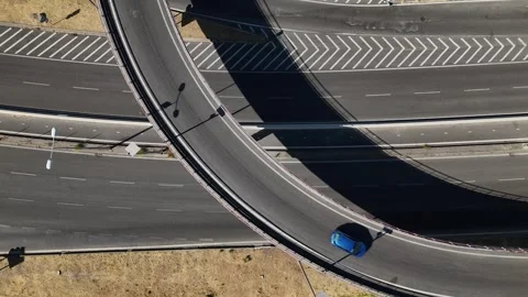 Traffic flows smoothly on a modern overpass at midday in an urban area Stock Footage 315710359