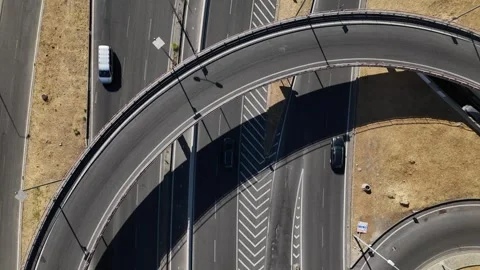 Traffic flows smoothly on a modern overpass at midday in an urban area Stock Footage 315710507