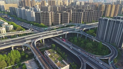 Traffic flows smoothly over a modern interconnected highway system in an urban Stock Footage 307315206