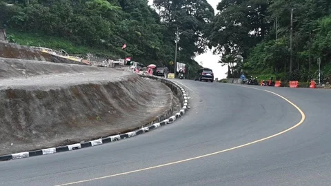 Traffic flows through the iconic Puncak Pass in West Java, Indonesia. Stock-Footage 341779392