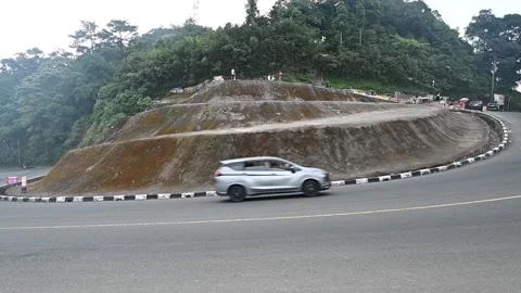 Traffic flows through the iconic Puncak Pass in West Java, Indonesia. Stock-Footage 341779393