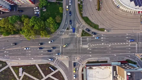 Traffic flows through an intersection in an urban area during the day with Stock Footage 342503253