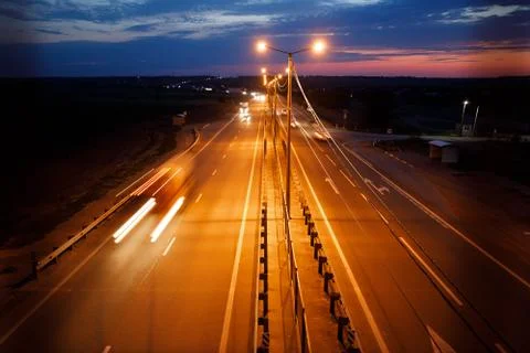 Traffic on freeway at twilight Stock Photos
