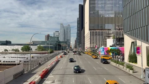 Traffic in front of Hudson Yards buildings.  New York City Subway MTA rail yard Stock Footage 336502860