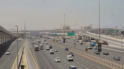 Traffic goes through the streets of Dubai Stock Footage 75843633