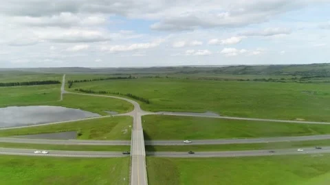 Traffic going through countryside road Stock Footage 155466515
