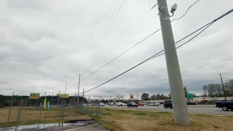 Traffic on Gordon Highway on a cloudy day in Augusta Georgia Stock Footage 148894787