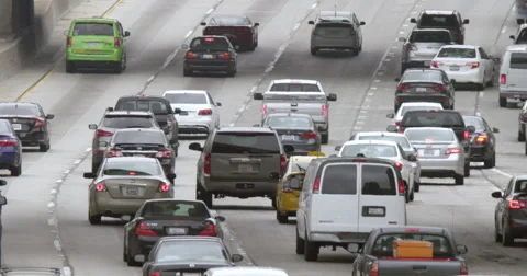 Traffic heading northbound on the 110 freeway in Downtown LA 4K Stock Footage 63647882