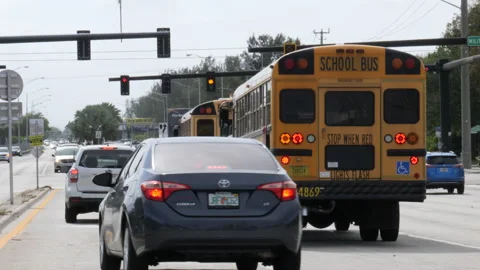 Traffic Heads Westbound on Sample Road to Military Trail Stock Footage 200853333