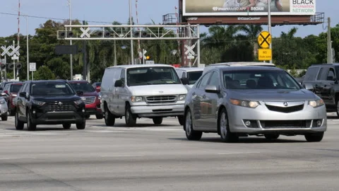 Traffic Heads Westbound on Sample Road at Military Trail Stock Footage 200853598