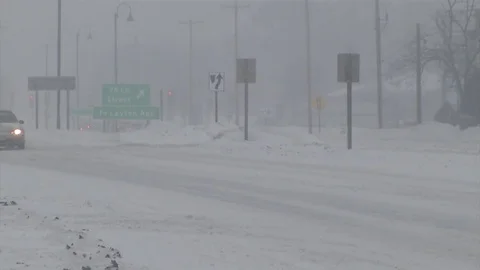 Traffic in heavy snow Stock Footage 98657732