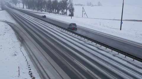 Traffic on highway during winter blizzard. Snowstorm on the road. Stock Footage 262624563