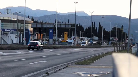 Traffic on a highway entering town of Split. Reduced traffic during early mor Stock Footage 129112422