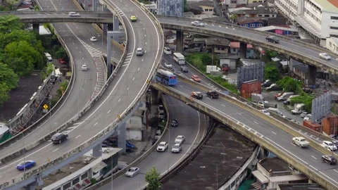Traffic on the highway road intersection in Bangkok, Thailand from day to night. Video stock 150378960