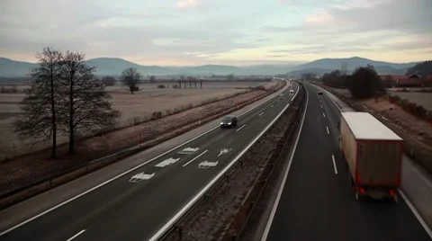 Traffic On a Highway in Time Lapse at Dawn. Video stock 10682751