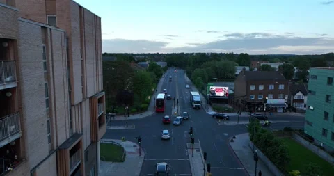 Traffic intersection along building in the early morning Stock-Footage 201753695